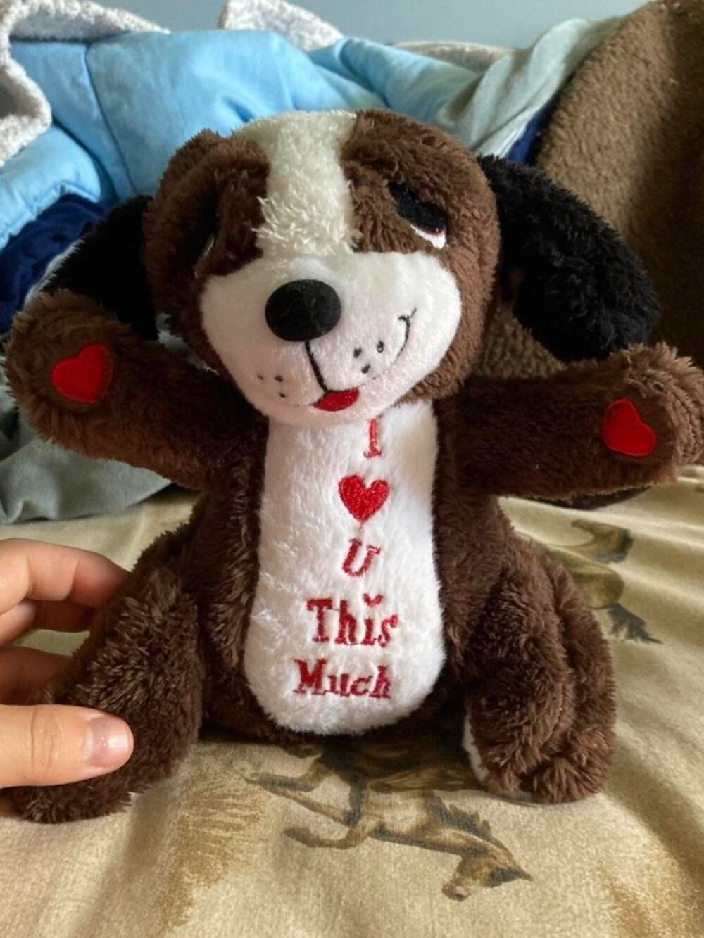 Brown and white plush dog with red hearts and the words 'I ❤️ U This Much'